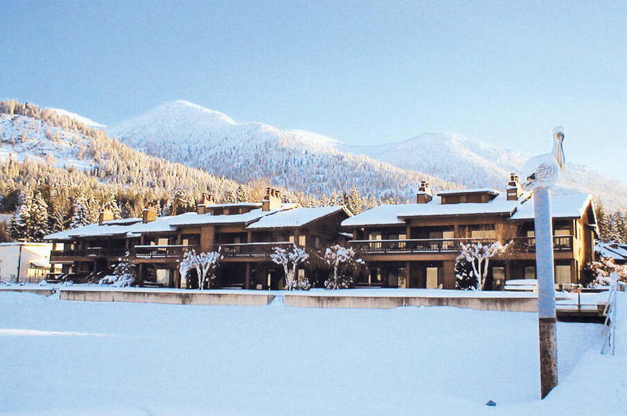 A winter view of the exterior building at VRI's Pend Oreille Shores Resort in Hope, Idaho.